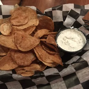 Free table app of homemade chips and dill dip.