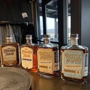 four bottles of whiskey on a table