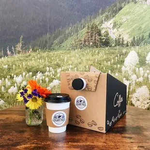 a cup of coffee and a box of coffee