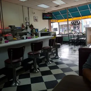 Small town diner with booths and counter seating.