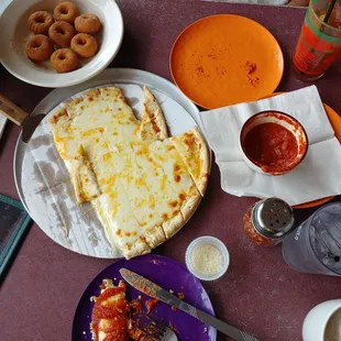 a plate of pizza and a plate of donuts