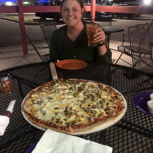 Medium pizza! Try the pepper, olive, pineapple combo. So good!