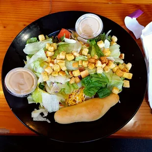Garden salad, Italian dressing and breadstick