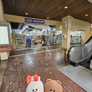 Located at the bottom of the escalator at Ward Centre