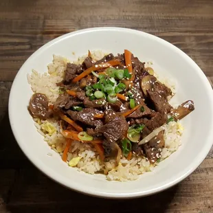 a bowl of rice and beef