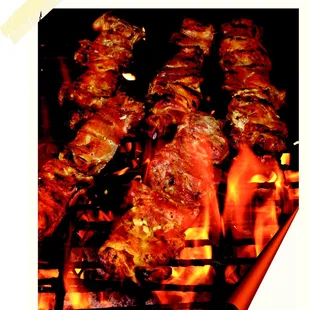 a bunch of meat on a grill
