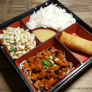 a bento box of food