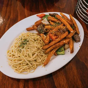 Bo Xao Khoai / Loi&apos;s Fusion Saltado (Rice, Filet Mignon, Fries, Tomato, Onion) Sub Garlic noodles.