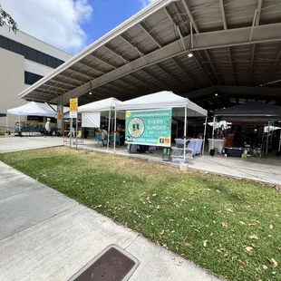a tent set up in front of a building
