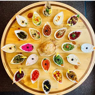 Humus,baba ghanus,spicy vegetables,labneh,tzatziki,ajvar,pink quen,eggpland salad