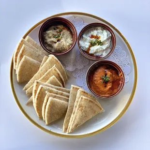 Spreads-
Muhammara, Baba Ganoush, Tzatziki &amp; warm pita