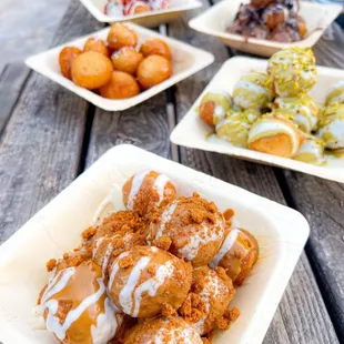 several plates of food on a picnic table