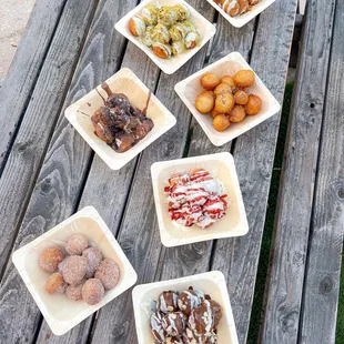 a variety of pastries on a picnic table