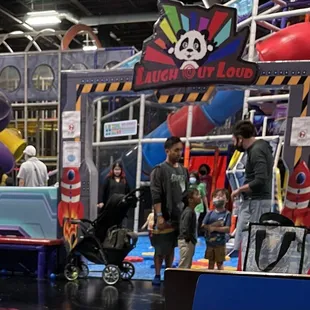 Adults inside the play area not wearing masks.