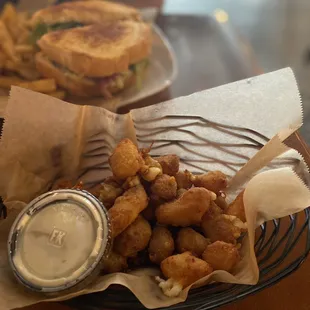 Teeny tiny portion of fried cheese curds.