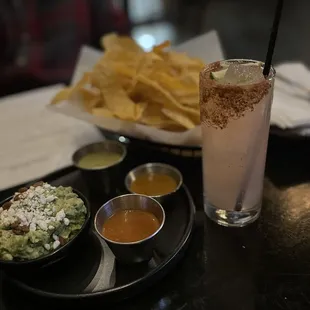 a plate of chips and a drink
