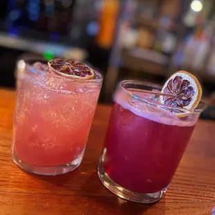 two cocktails on a bar