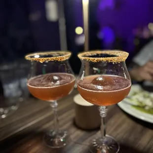 two glasses of wine on a table