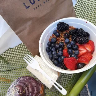 Fruit &amp; yogurt granola bowl, two pastries.