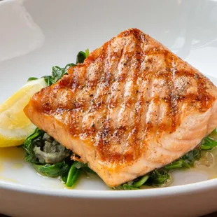 a plate of salmon and spinach