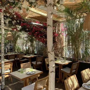 tables and chairs under a canopy