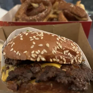 a hamburger and onion rings