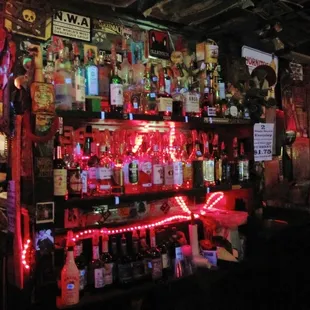 a man standing in front of a bar