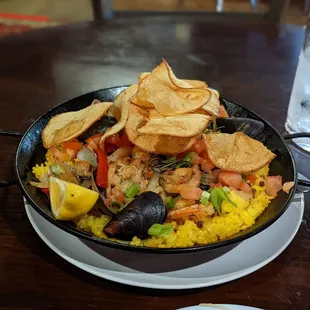 Paella with potato crisps