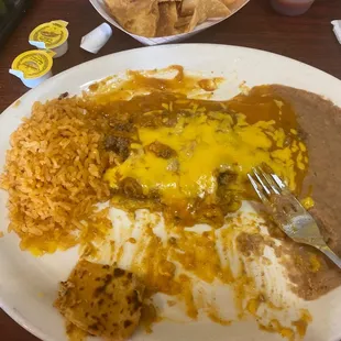 a plate of enchiladas and rice