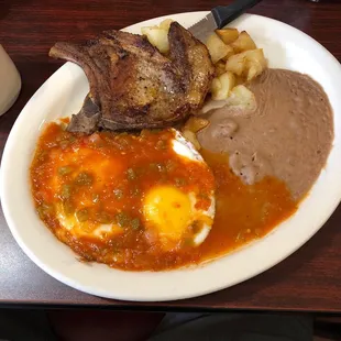 Huevos rancheros with pork chop.