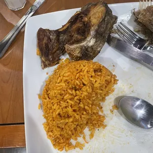 a plate of rice and meat