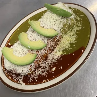 a plate of food with avocado and cheese