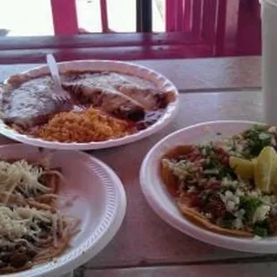 three plates of food on a table