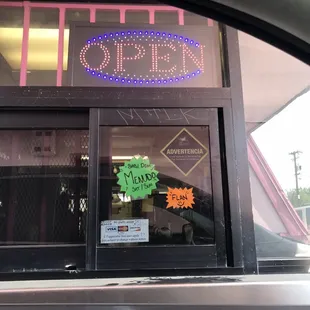 a neon sign in the window