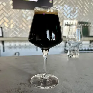 Scylla Imperial Stout. Balanced between dry and bitter, rich body.