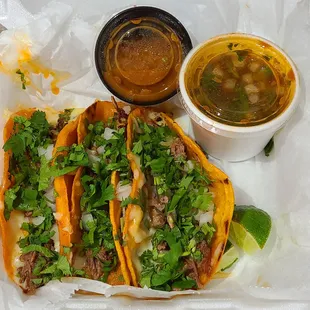 Quesabirria tacos serving... that hot sauce in  the black container is wonderful!