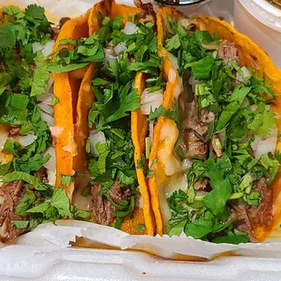 Quesabirria tacos... lots of cilantrol Delicious!