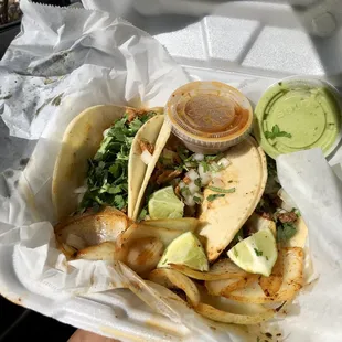 a close up of a taco in a styrofoam container
