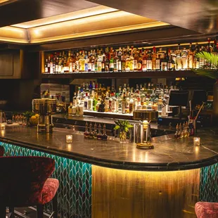 a bar with many bottles of alcohol