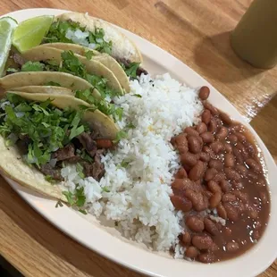 Carne asada tacos with rice and beans