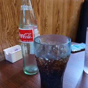 a coke and a glass of coke