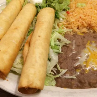 Dinner last night : ) three chicken flautas dinner plate