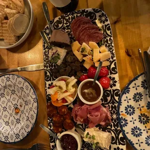 a platter of meat and cheeses