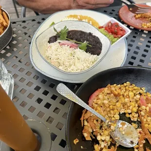 Our friend got pork tacos but his sides were almost as good as. A dish on their own.