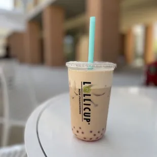 a cold beverage in a plastic cup