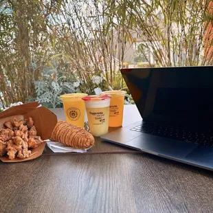 a laptop and a cup of coffee on a table