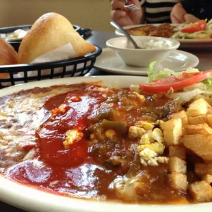 Lollie's Combination plate, red chili cheese enchilada, chili relleno smothered with green chili and taco (not shown).