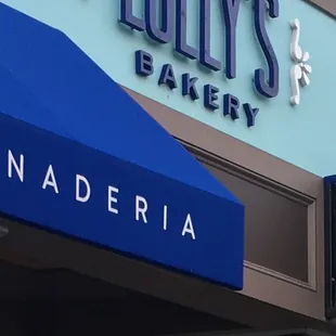 a blue awning on a storefront