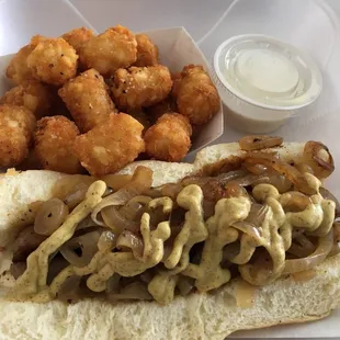 Lolly bratwurst Dog (on king Hawaiian sub roll, grilled onions and homemade spicy mustard) and small tater tots!  Delicious!!!