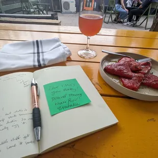 funky wavy wines skin contact wine and red peppers on the back patio